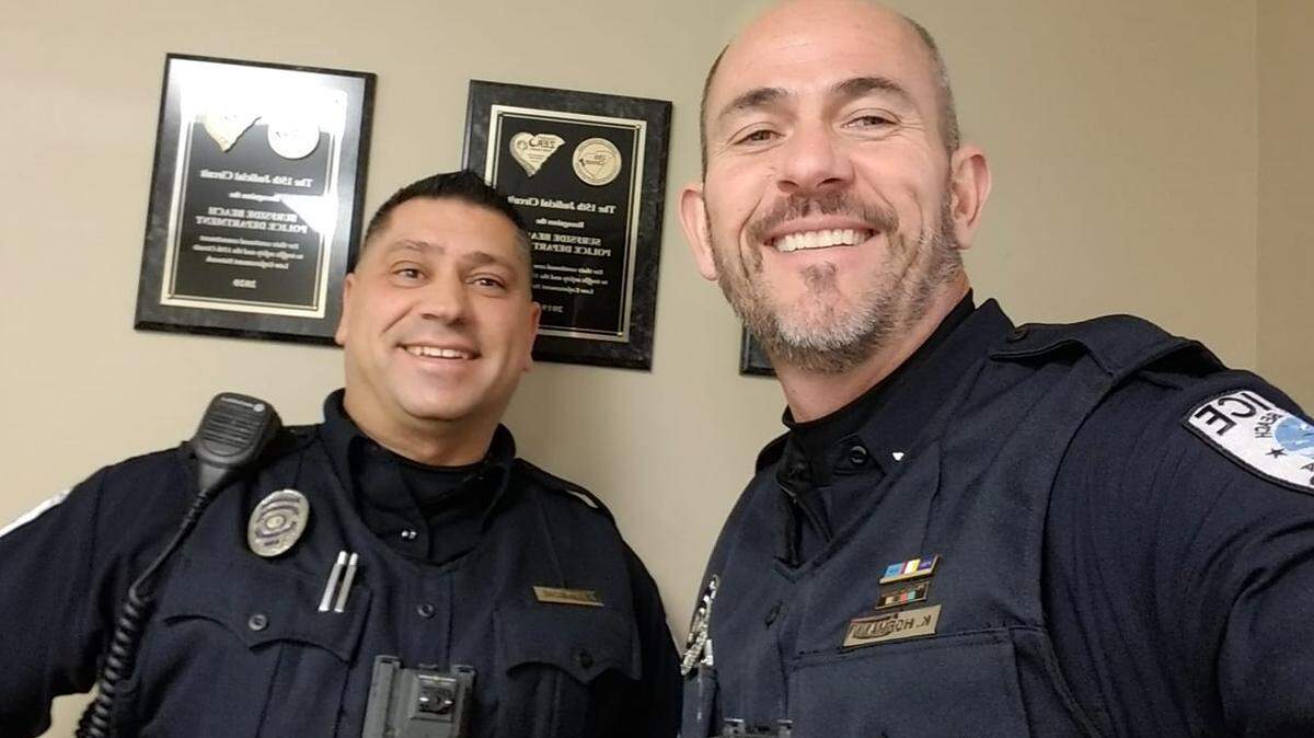 Surfside Beach Police Chief Kenneth Hofmann (right) poses with former Sgt. John Gambone.