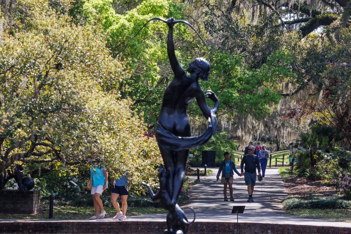 Visitors and volunteers enjoy the Spring weather as the flowers begin to bloom in Brookgreen Gardens.  April 2, 2025.