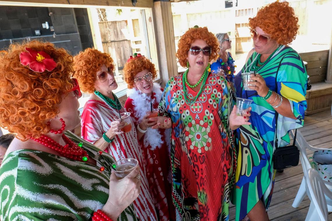 The Grand Strand Chapter of the International Order of Mrs. Ropers, a club where participants dress as Helen Roper from the late 1970s to 1980s TV series “Three’s Company,” went on a pub crawl with Tito’s Trolley Company in Myrtle Beach on Saturday. The group visited several area bars taking pictures and joking with other patrons. July 18, 2025.