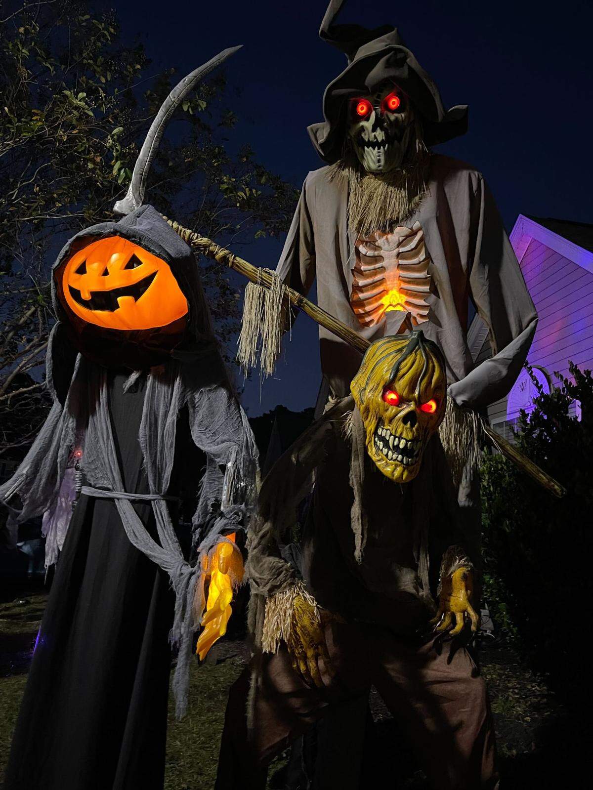 A collection of Bodhi Pierce’s Halloween decorations lit up at night.