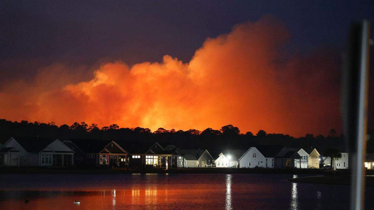Fire and plumes of smoke could be seen in the Waterbridge community of Carolina Forest Saturday. Residents in Walkers Woods and Avalon neighborhoods were evacuated from their homes as a wildfire raged in the area. Firefighters were battling several fires across the county. March 1, 2025