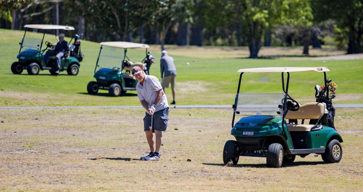 Myrtle Beach resident Denny Sweeney chips at Whispering Pines Golf Course on Friday afternoon in Myrtle Beach. More than 65 golf courses on the Grand Strand remain open to provide local residents an outdoor recreation activity in the midst of South Carolina Governor Henry McMaster’s order for all nonessential businesses in the state to close in an effort to fight the COVID-19 coronavirus.