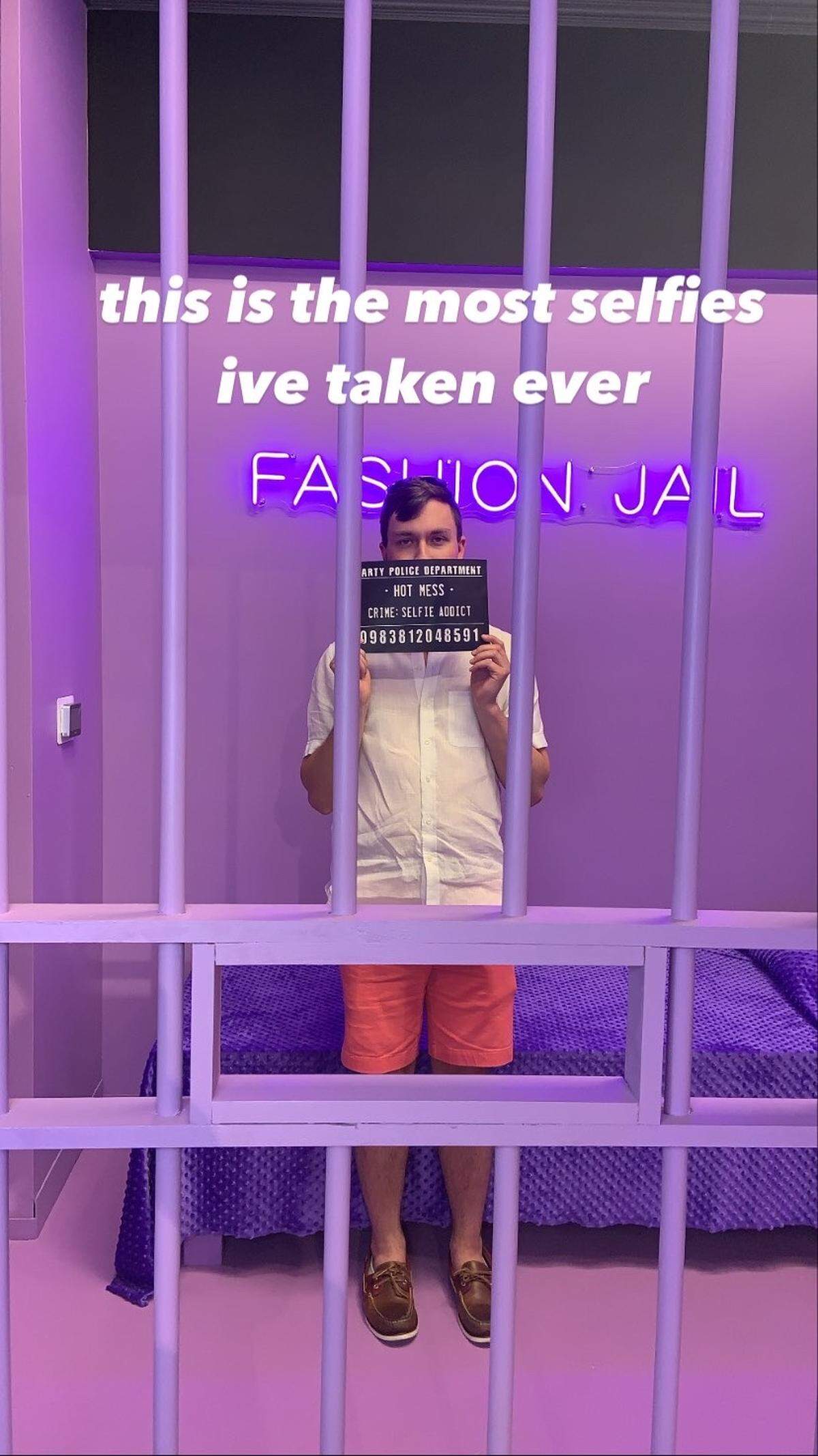 The Fashion Jail featured lighthearted placard “charges” to hold up behind pretend jail bars.