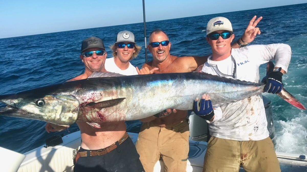 The crew of Game Hawg including Jerry Fehlig, Wade Fehlig, Joey Arakas and Watson Fehlig show off a 70.5-pound wahoo that was the biggest caught in the Georgetown Wahoo Challenge last weekend.