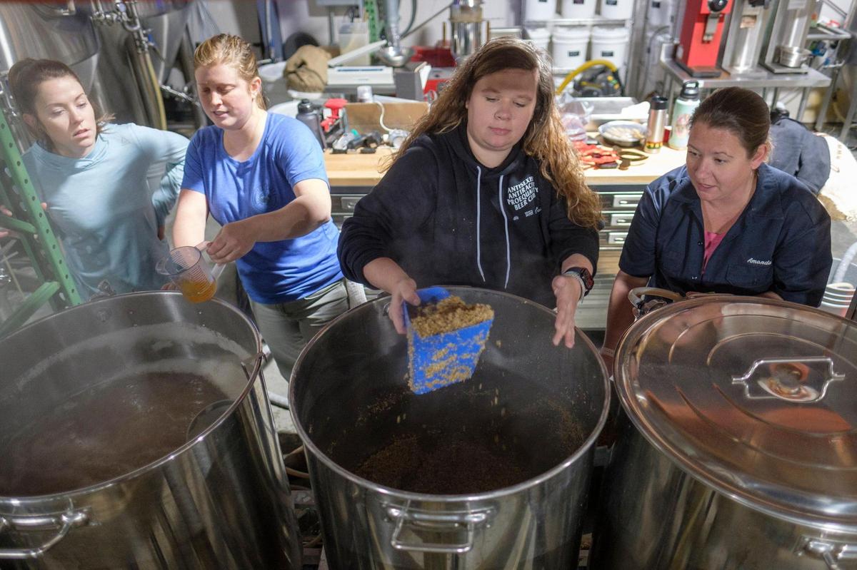Female brewers and bartenders (L-R) Leah Antonelli, Jordan Skeen, Taylor Garrity, and Amanda Post work brewing a Hazy Pale Ale called “Brave Noise.” on Tuesday, Dec. 21, 2021. The collaborative brew is a national movement to end sexism and discrimination in the brewing industry.