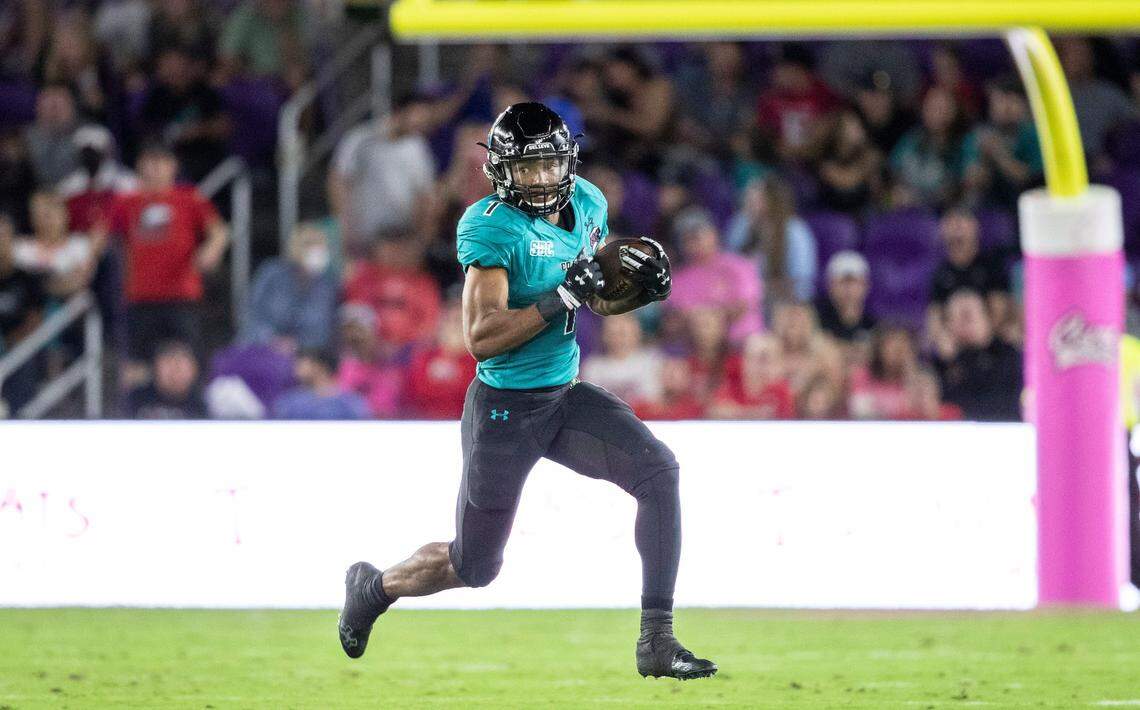 Coastal Carolina running back Braydon Bennett (1) runs the ball against Northern Illinois during the Cure Bowl NCAA college football game in Orlando, Fla., Friday, Dec. 17, 2021. (Willie J. Allen Jr./Orlando Sentinel via AP)