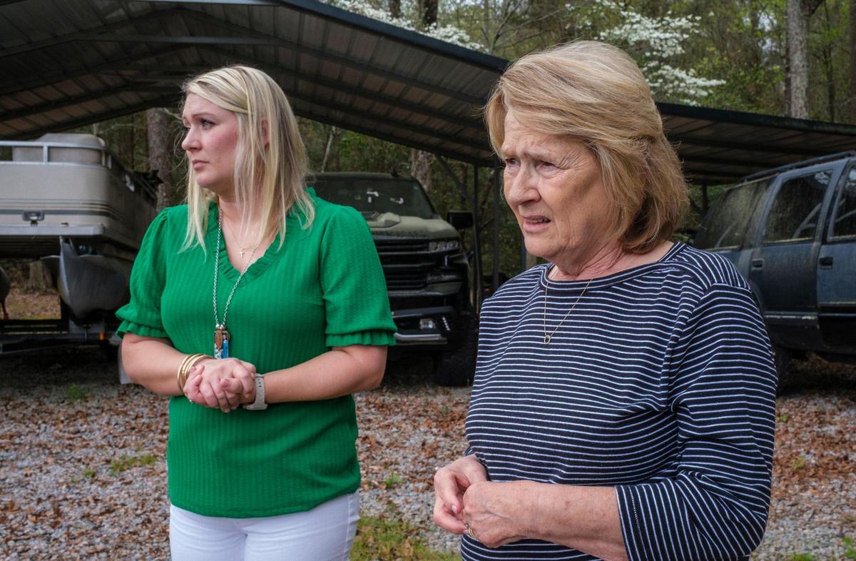 Deborah Spivey, mother of Scott Spivey and his sister Jennifer Foley, stand in front of his bullet ridden truck months after his shooting death. March 31, 2025.