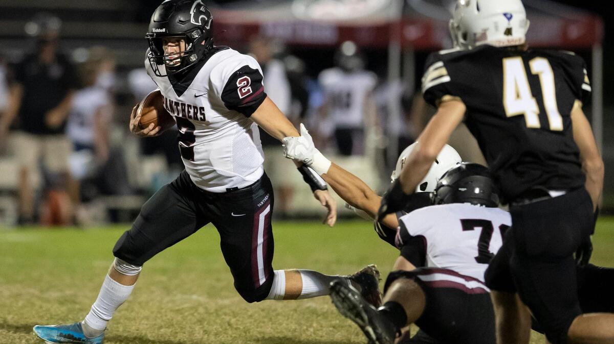 Carolina Forest running back Luke Janack (2) breaks tackles during a long gain against Socastee during 1st quarter action Friday at Socastee High School.
