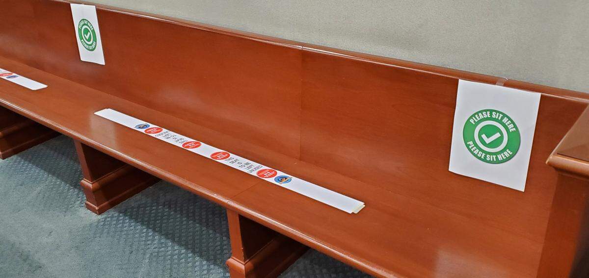 Benches in an Horry County courtroom are marked for social distancing. The county is one of the first in South Carolina to hold jury trials after being closed for coronavirus.