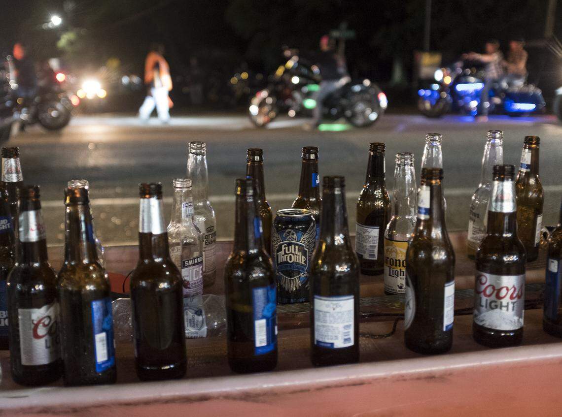 Beer bottles line the barricades in Murrells Inlet on Friday night. Myrtle Beach Bike Week kicked into high gear Murrells Inlet area venues on Friday evening. May 17, 2018. 