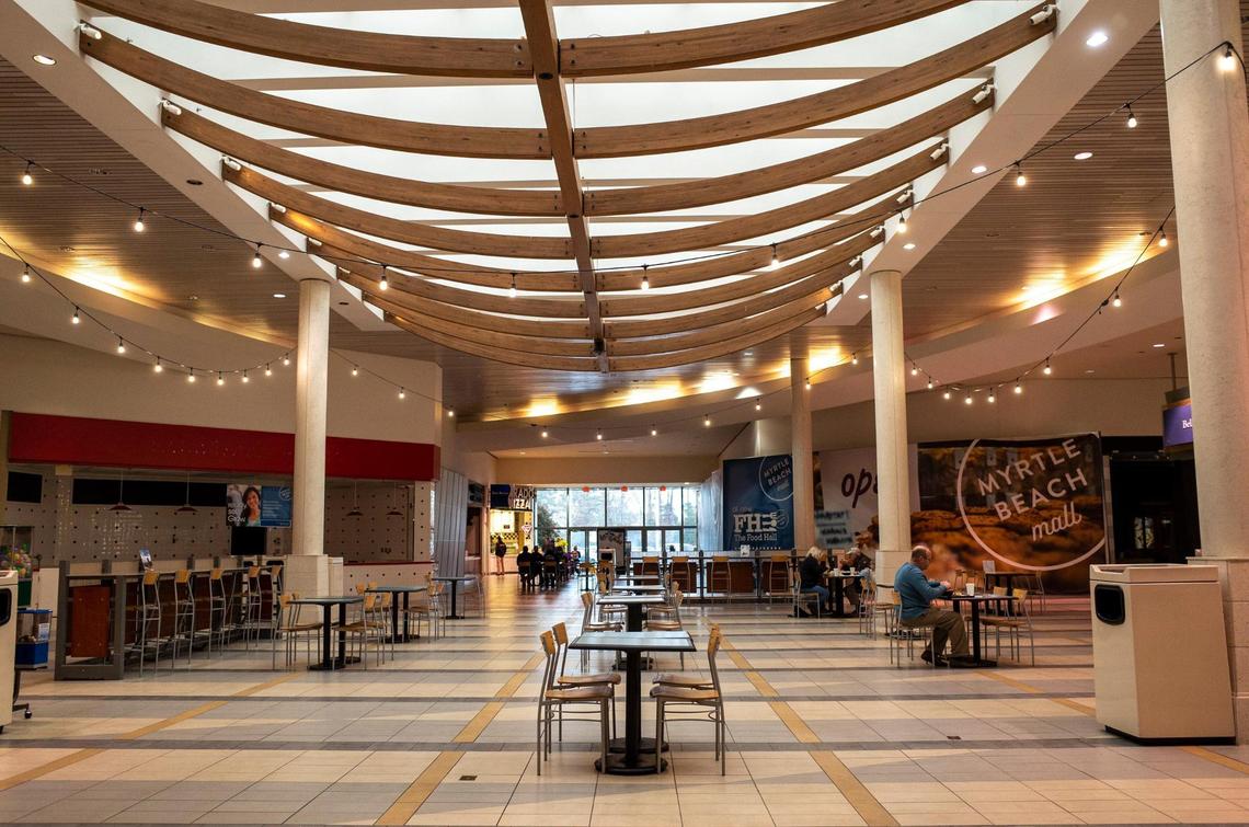 Despite being the shopping season, few people walk the halls of the Myrtle Beach Mall where many shops lie shuttered. Dec. 21, 2021.