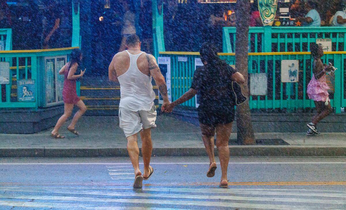 Downtown visitors rush for cover as a summer thunderstorm hits Myrtle Beach, SC on Friday evening. Downtown Myrtle Beach’s tourist district was relatively quiet for a Summer evening on Ocean Boulevard and the Boardwalk. Storms put a damper on the evening activities but as the skies cleared, visitors returned to enjoy the attractions. Friday, May 30, 2025.