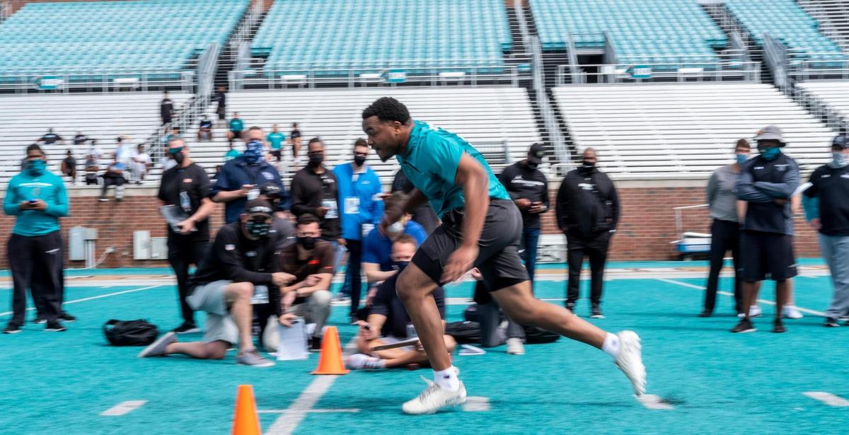 Former Coastal Carolina defensive lineman Sterling Johnson runs past NFL scouts at CCU’s Pro Day on Tuesday at Brooks Stadium in Conway, S.C. March 23, 2021.