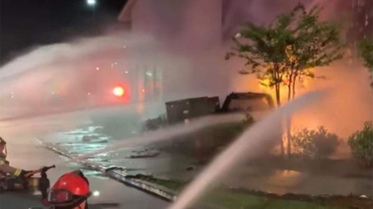 Myrtle Beach firefighters contain a blaze at the intersection of Farrow Parkway Parkway and Fred Nash Blvd. that broke out about 9 p.m. on July 25, 2022.