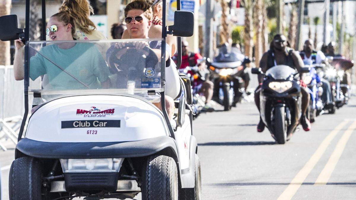 Golf carts flow along with bike traffic on Ocean Boulevard on Tuesday, May 24, 2025. On May 22, new golf cart regulations were signed into state law. So far, Myrtle Beach hasn’t issued any citations under the new rules.