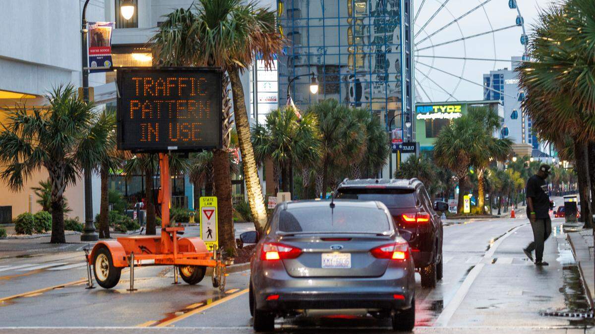 A sign reminds drivers of adjusted one-way traffic patterns on Ocean Boulevard. The practice known as “flushing” closes the Northbound lane of traffic to all except emergency vehicles. Downtown Myrtle Beach’s tourist district was relatively quiet for a Summer evening on Ocean Boulevard and the Boardwalk. Storms put a damper on the evening activities but as the skies cleared, visitors returned to enjoy the attractions. Friday, May 30, 2025.