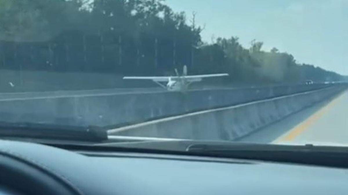 A screenshot from a TikTok video by sir_veteranguy shows a small plane making an emergency landing Sunday on Highway 22 in the North Myrtle Beach area. The plane was flying over vehicles minutes before it landed.