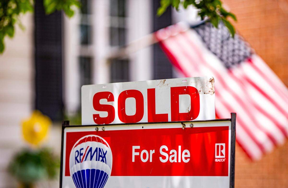 A SOLD sign is attached to a For Sale sign outside a home on Friday, May 21, 2021, in South Bend, Indiana. A LendingTree survey finds that renting costs less than buying in every large metropolitan area in the United States, including several in California.