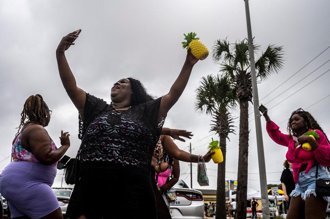Woman dance in Atlantic Beach at the start of the 2022 Black Bike Week. The Atlantic Beach Bike Festival, aka “Black Bike Week,” returned on Friday after being canceled the last two years due to COVID-19. The event got off to a slow start in Atlantic Beach due to rain but parties were held in covered parking garages around North Myrtle Beach and as the rain cleared, the bikers returned. May 27, 2022.