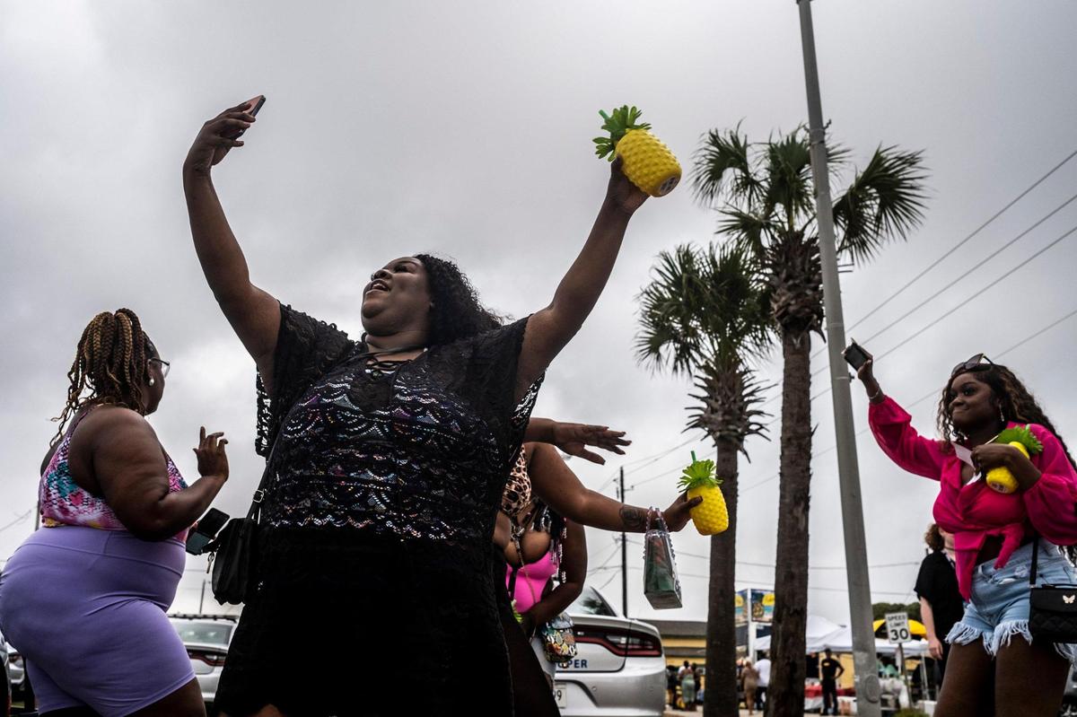 Woman dance in Atlantic Beach at the start of the 2022 Black Bike Week. The Atlantic Beach Bike Festival, aka “Black Bike Week,” returned on Friday after being canceled the last two years due to COVID-19. The event got off to a slow start in Atlantic Beach due to rain but parties were held in covered parking garages around North Myrtle Beach and as the rain cleared, the bikers returned. May 27, 2022.