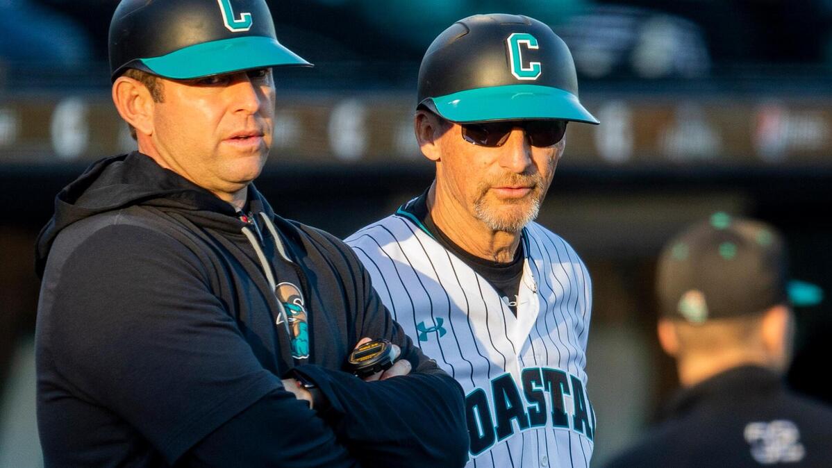 Coastal Carolina baseball coach Gary Gilmore, right, and assistant head coach Kevin Schnall