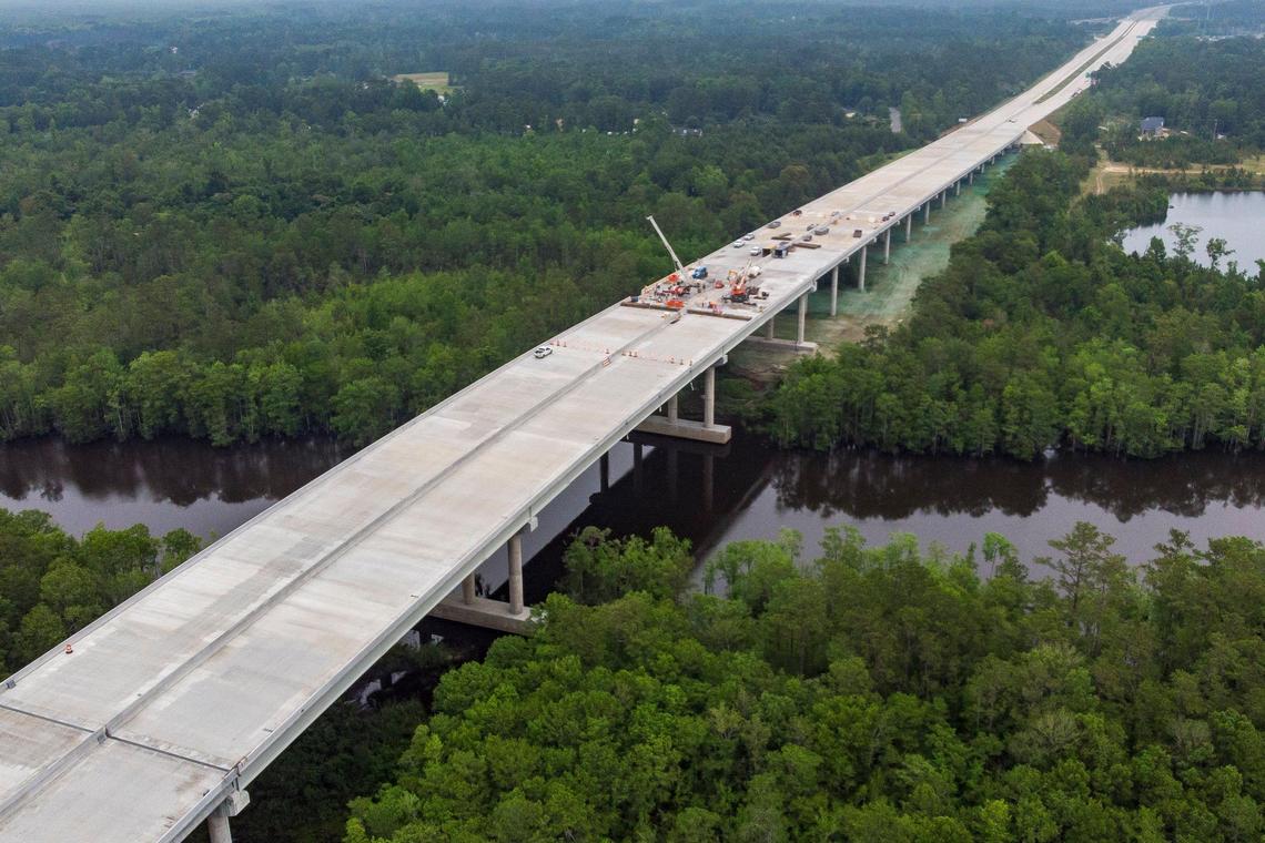 Crews work on the Highway 31 Bridge over the Intracoastal Waterway near Socastee. Extending the corridor to SC 707 has taken longer than expected. The new bridge over the Intracoastal Waterway needs to be resurfaced before the road opens and is not expected to be completed until the fall of 2019.