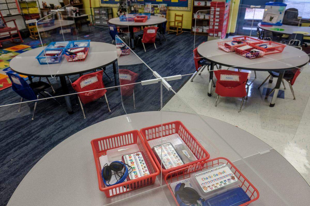 Plexiglass dividers have been placed around desks at Aynor Elementary School to help protect students and teachers from the spread of the coronavirus. December 3, 2020.