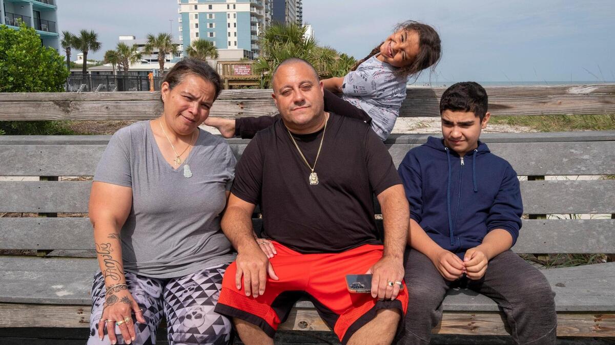 Federico and Rafaela Rivera along with their sons Angel (center) and Fredrick (right) moved from New York to Myrtle Beach for a safer living environment. The family receive federal assistance but have been unable to find reliable affordable housing and have bounced from hotel to hotel since moving, exhausting their money and leaving them with no place to go as hotels shift to daily tourism rates. March 28, 2023.