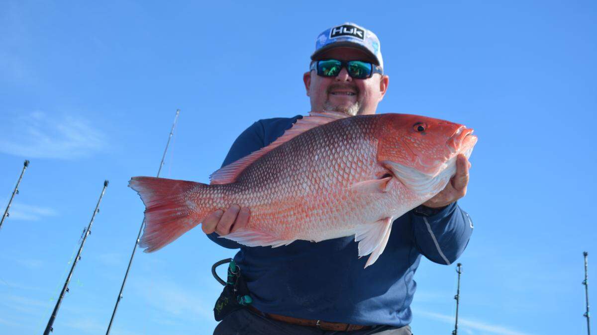 Capt. Henry Anderson displays a red snapper caught and released aboard Heiden Seek out of Georgetown.