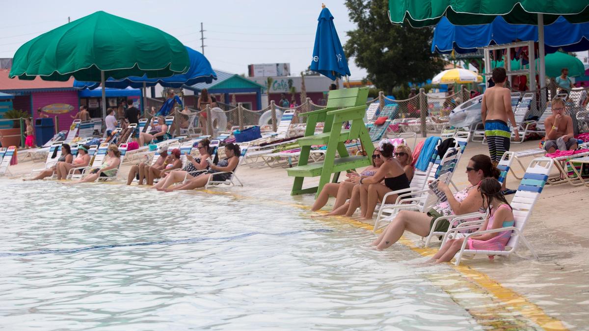 Water park guests relax in the shallow end of the wave pool at Myrtle Waves in Myrtle Beach on June 22, 2018.
