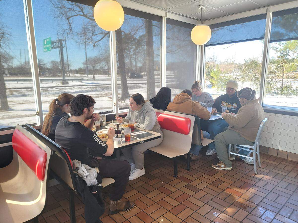 Diners gathered inside Waffle House with snow on the ground outside on Sunday, Feb. 1, 2026.