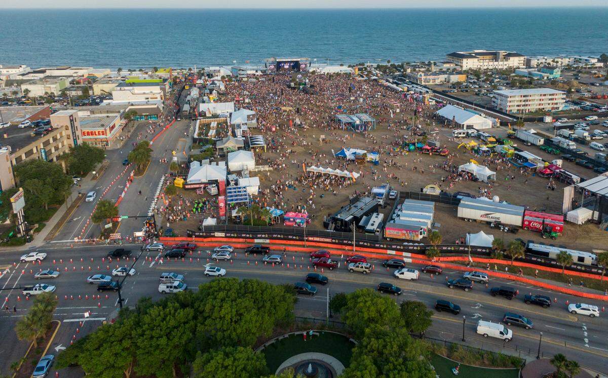 Country music fans arrive for the first night Carolina Country Music Fest 2024. The four day event is expected to draw 30,000 each night at the Burroughs and Chapin Pavilion Place in Myrtle Beach, S.C. Thursday, June 6, 2024.