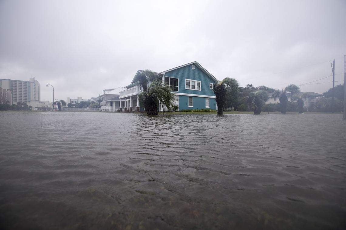 Ponding covers part of the road and yard of a home at 7th Avenue North Ocean Boulevard in North Myrtle Beach on Saturday morning hours before the expected storm surge from Florence. September 15, 2018.