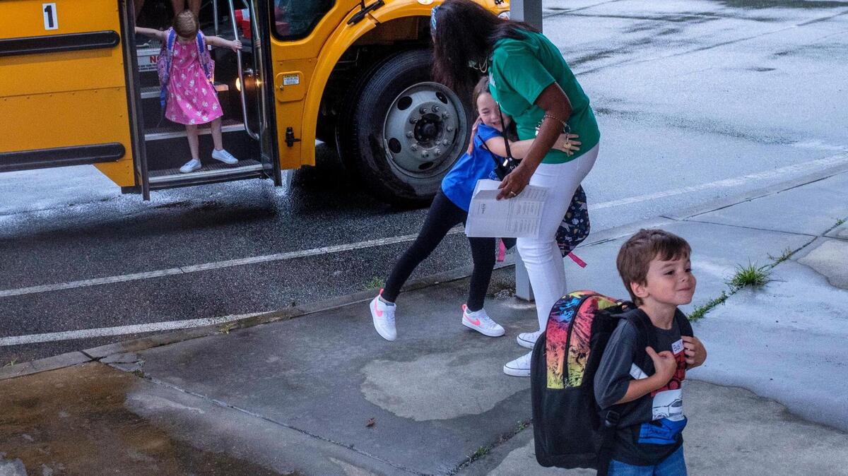Students arrive at Homewood Elementary via bus on Tuesday. In-person classes resumed today in Horry County Schools. While many teachers, parents and students expressed excitement at being back, some are concerned the the latest spike of COVID-19 cases in South Carolina and what that might mean for the 2021-2022 school year. Aug. 11, 2021.