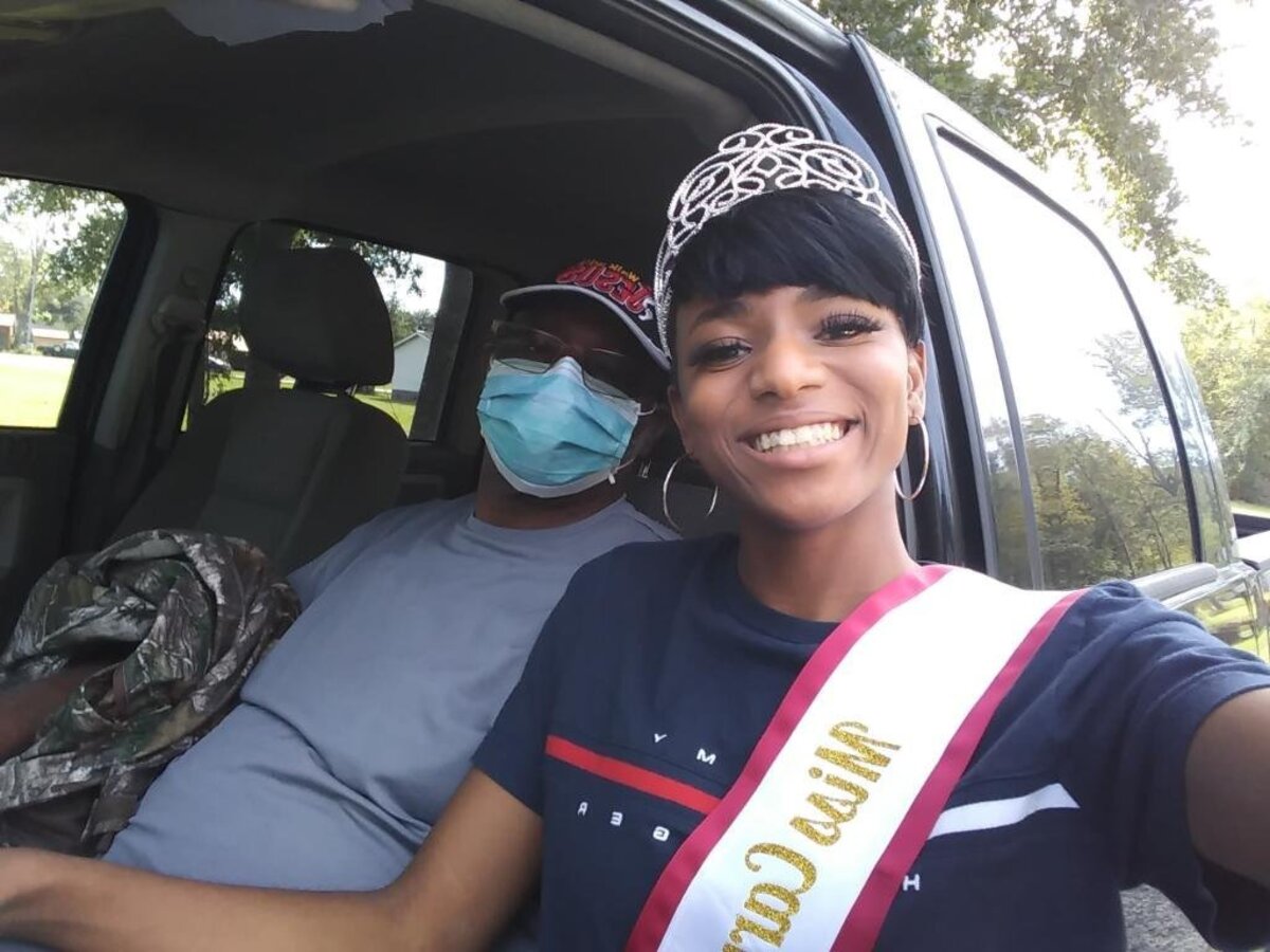 Melissa Jefferson wearing her Carvers Bay High Homecoming Queen crown and sash, with her father Melvin, a couple months after the two took part in a stem cell transplant in 2018.