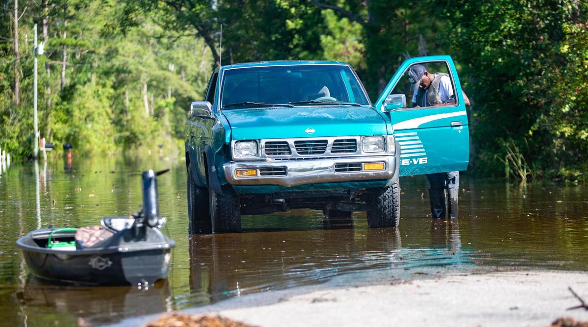 Wampee resident Busbee Livingston prepares to head to his home on Collins Road Sunday.
