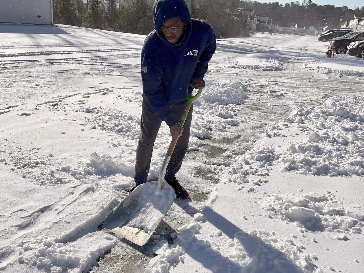Michael Lindsay worked to shovel snow from the driveway at his Conway area home on Sunday, Feb. 1, 2026.