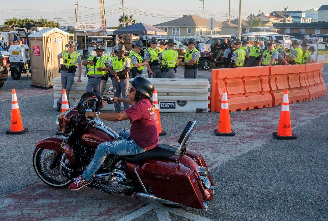 A contigent of police officers watch over the Atlantic Beach Black Pearl Cultural Heritage and Bike Festival in Atlantic Beach. May 23, 2025.