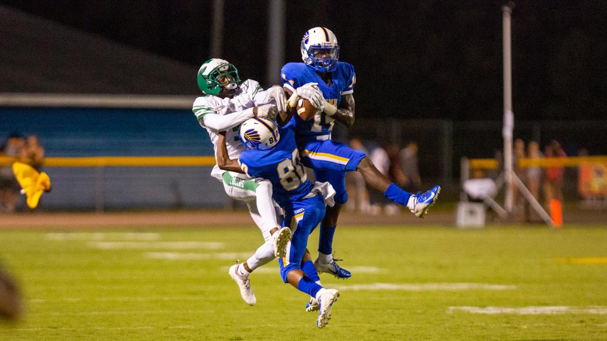 North Myrtle Beach Chiefs defensive back Darrien Holmes intercepts a pass from West Brunswick quarterback Jay Fletcher as the Chiefs play the West Brunswick Trojans at home. A flag was thrown on the play, and the interception was ruled an incomplete pass. The Chiefs beat the Trojans 35-10.