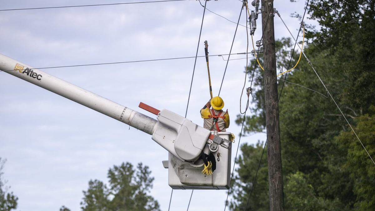 File photo. Crews from Horry Electric Cooperative and Williams Electric Power work on downed power lines off Hwy. 65 in the Maple community. Residents of Horry County breathed a collective sigh of relief today after Hurricane Dorian passed with only minor damages. Friday Sept. 06, 2019.