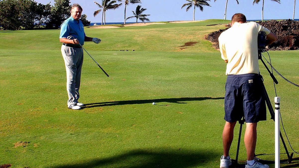 Mike Shroder gives instruction as John Erlenbach films during an episode of the show Links Illustrated that was filmed on the Grand Strand for several years.