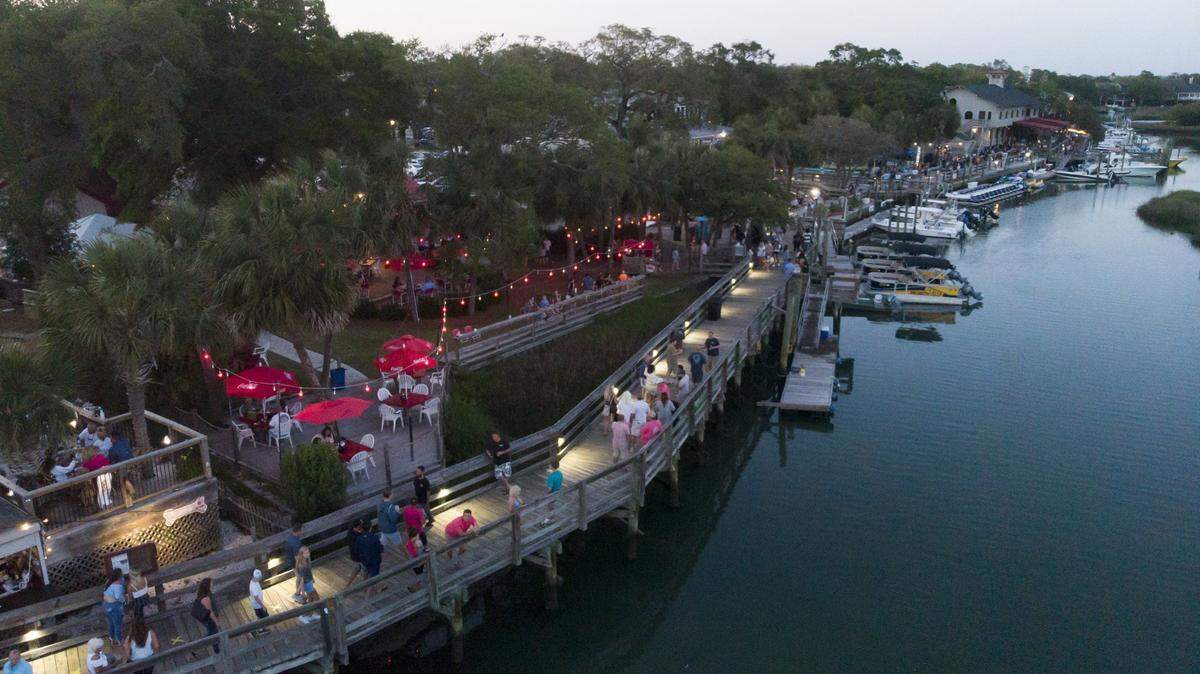 Visitors at the MarshWalk in Murrells Inlet can bring open containers of alcohol with them between establishments.