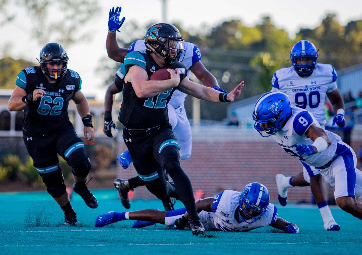 Coastal Carolina quarterback Bryce Carpenter runs the ball against the Georgia State Panthers on Oct. 12, 2019 at Brooks Stadium in Conway.