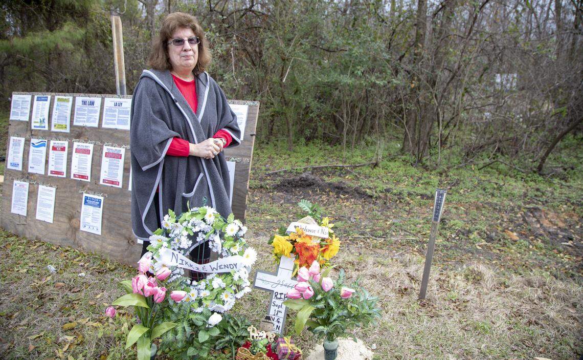Linda Green visits the place along Highway 76 near Nichols, S.C., where her daughter, Nikki Green, and Wendy Newton died Sept. 18 in a sheriff’s van.