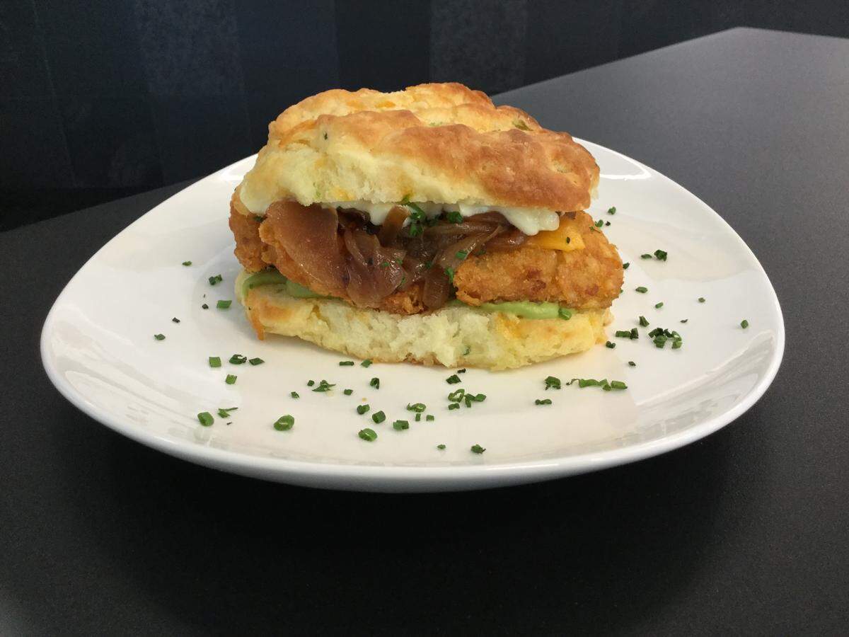 “Hash It Up” at 10/Fold Biscuits features a jalapeno-cheddar biscuit, crispy hash brown, whipped avocado, caramelized onions, cheddar cheese and Duke’s mayonnaise.