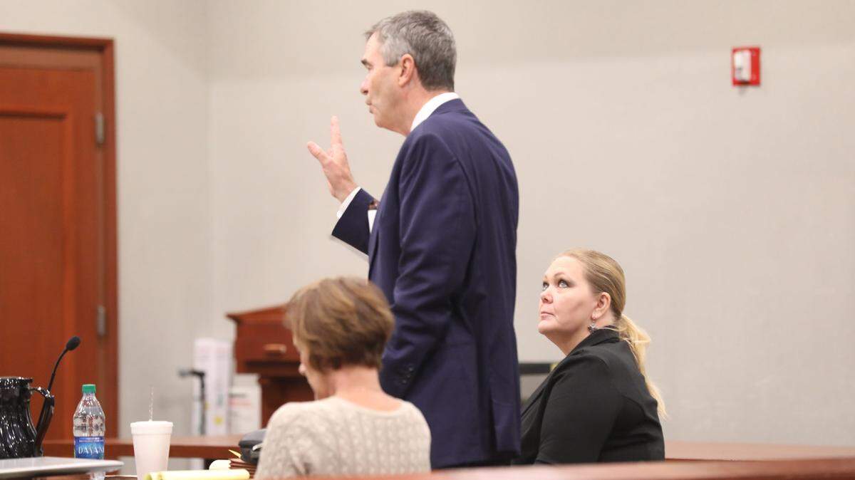 Tammy Moorer listen to her attorney Greg McCollum address the court on Friday during her trial.