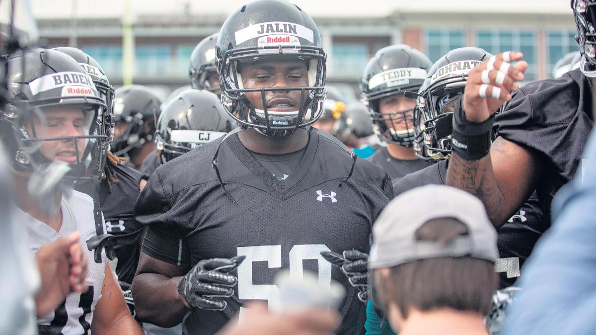 Coastal Carolina defensive lineman Jalin Walker stands with the rest of the team as the Chants prepare to start practice on Friday, Aug. 3 at Brooks Stadium in Conway, S.C.