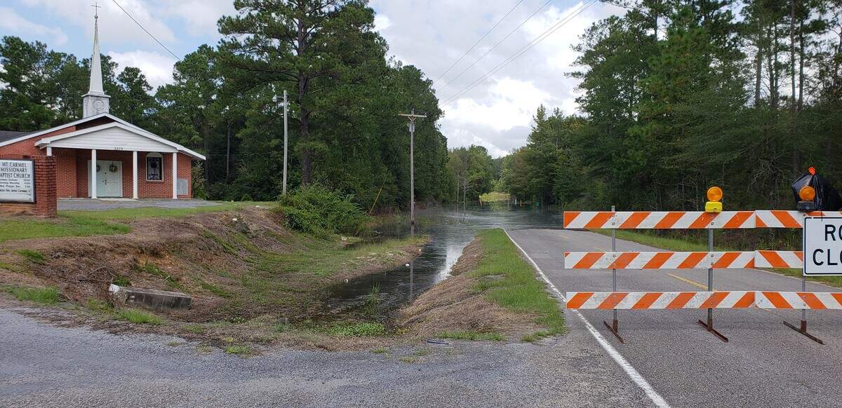 A National Guard vehicle had to turn around when it came to these waters over a road in the Plantersville area of Georgetown County