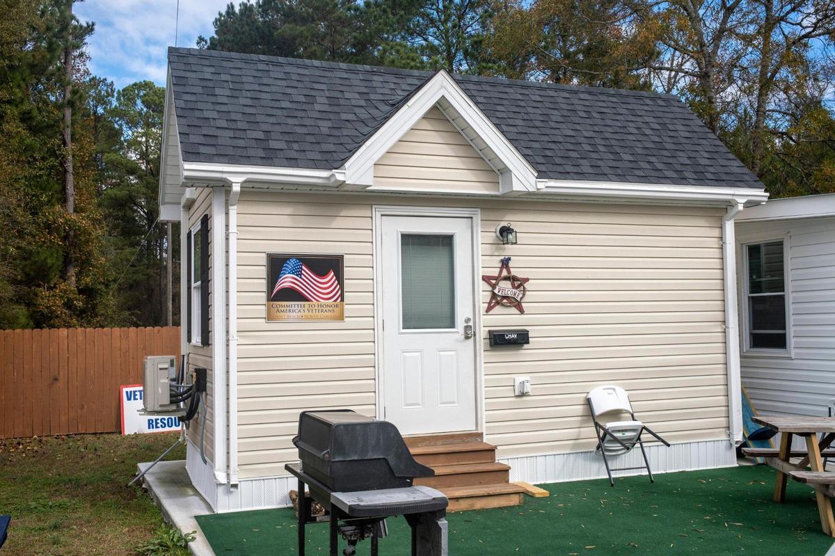Scott Dulebohn, Executive Director of the The Veteran’s Welcome Home and Resource Center shows the model tiny home that houses previously homeless veterans at their Little River, S.C. location. The homes are 144 square feet of living space for veterans that would otherwise be homeless.The organization is currently building 25 tiny homes on Third Avenue North in Myrtle Beach that are expected to be completed in the next six weeks. December 6, 2022.