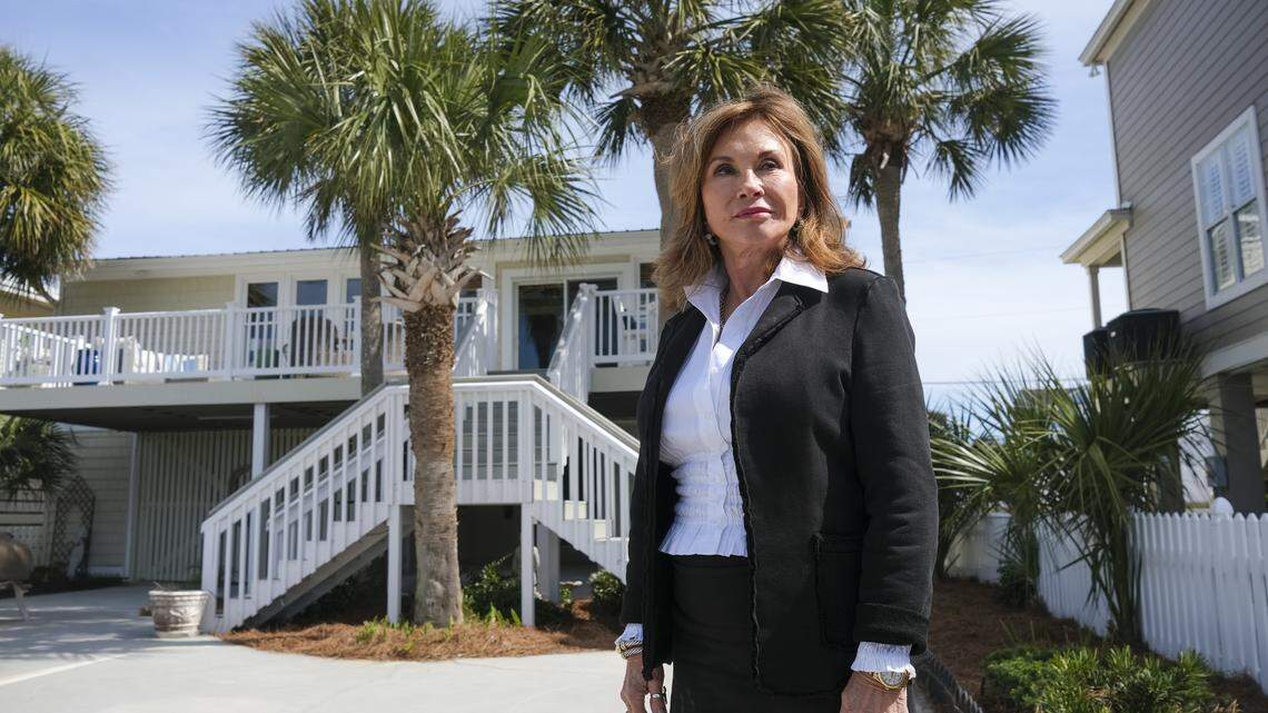 Mary Etta Williams looks out over the Murrells Inlet marsh from her home in Garden City, S.C. Williams has remodeled the lower portion of her home with waterproof materials to make it more resistant to the flooding that she says is happening more frequently in recent years. March 22, 2026.